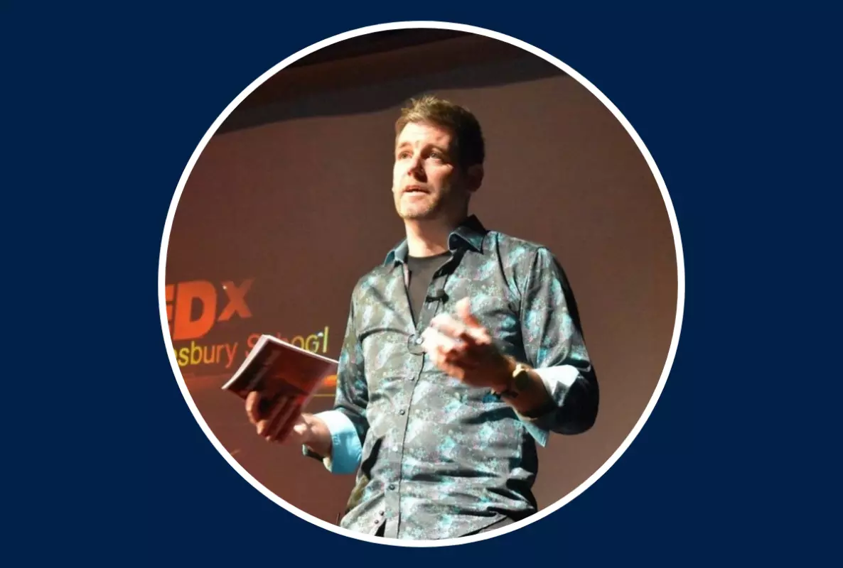 Man standing delivering a talk